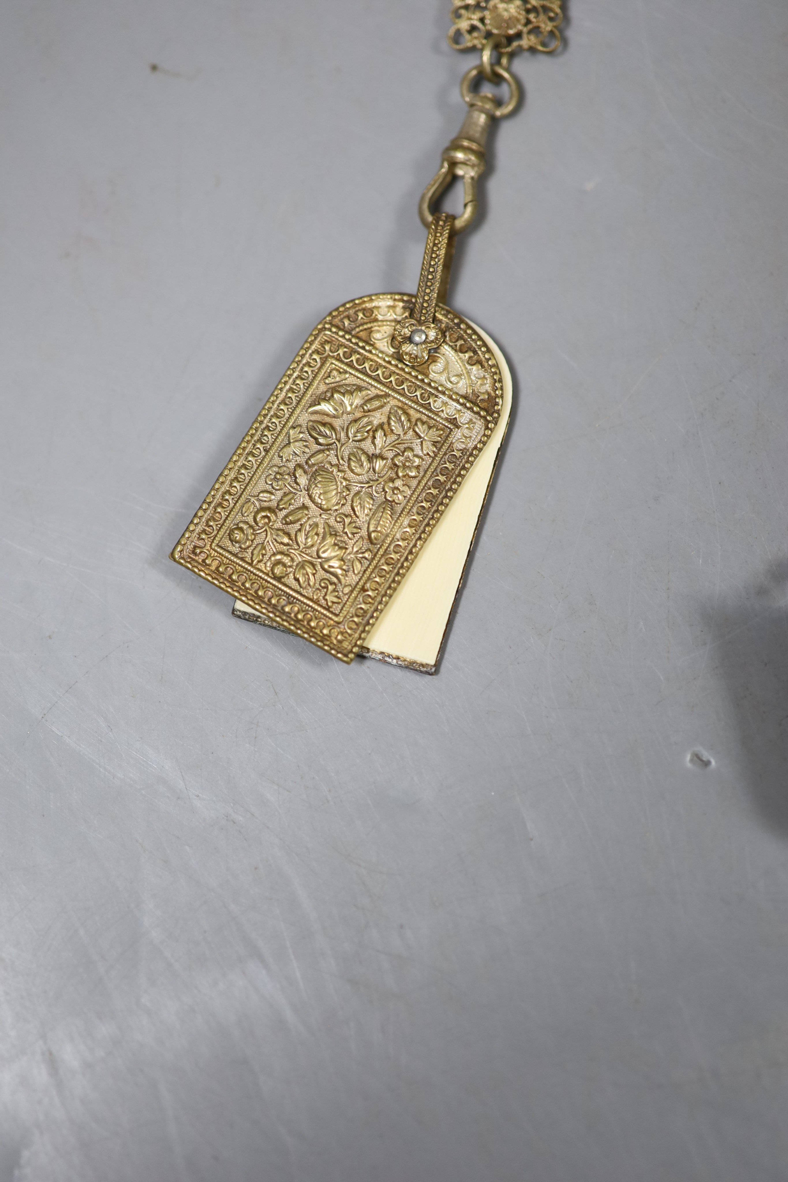 A Continental pierced gilt metal chatelaine hung with five accoutrements, 32cm